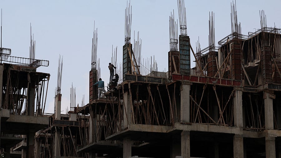 <div class="paragraphs"><p>Workers fasten iron rods together at the construction site of a residential building of Pradhan Mantri Awas Yojana. (Representative image)&nbsp;</p></div>