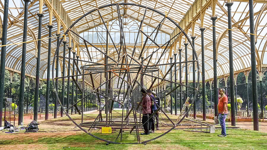 <div class="paragraphs"><p>Workers are busy with preparations for the Republic Day Flower Show in Lalbagh, Bengaluru. The 217th edition of the flower show, themed around Maharshi Valmiki, the creator of epic Ramayana, will begin on Jan 16. </p></div>