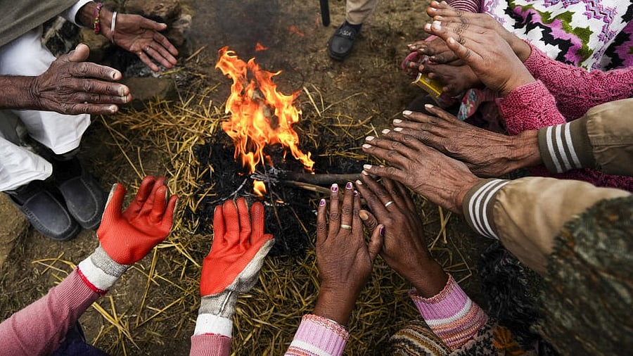 <div class="paragraphs"><p>People warm themselves around a bonfire on a foggy winter morning, on the outskirts of Amritsar, Thursday, Jan. 9, 2025.</p></div>