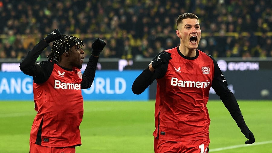 <div class="paragraphs"><p>Bayer Leverkusen's Patrik Schick celebrates scoring their second goal with Jeremie Frimpong</p></div>