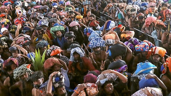 <div class="paragraphs"><p>Devotees arrive at the Sabarimala temple, in Pathanamthitta, Kerala, Tuesday.&nbsp;</p></div>