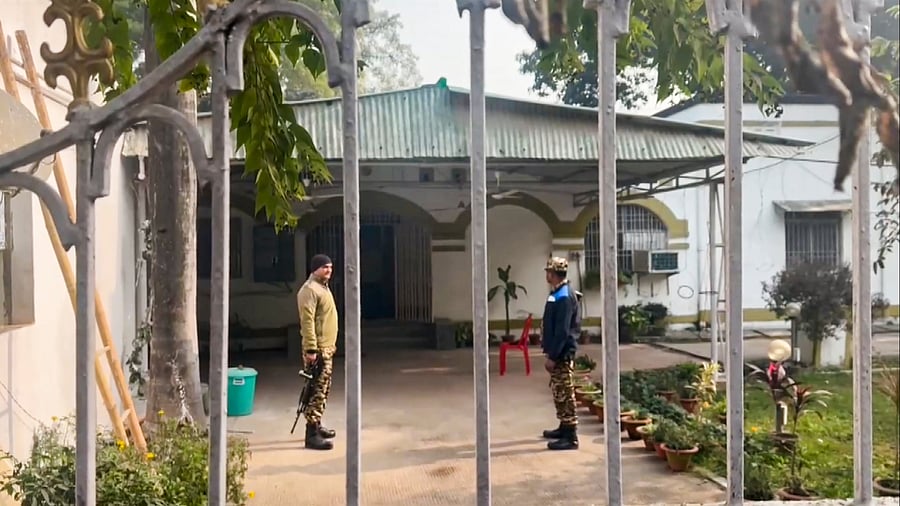 <div class="paragraphs"><p>Security personnel stand guard during a raid by the Enforcement Directorate at a premise linked to RJD MLA and former Bihar minister Alok Kumar Mehta, as part of a money laundering investigation linked to an alleged funds embezzlement at a state cooperative bank, in Patna.&nbsp;</p></div>