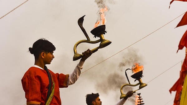 <div class="paragraphs"><p>Priests perform 'Ganga Aarti' at a 'ghat' ahead of Maha Kumbh Mela 2025, in Prayagraj, Uttar Pradesh, Sunday,</p></div>
