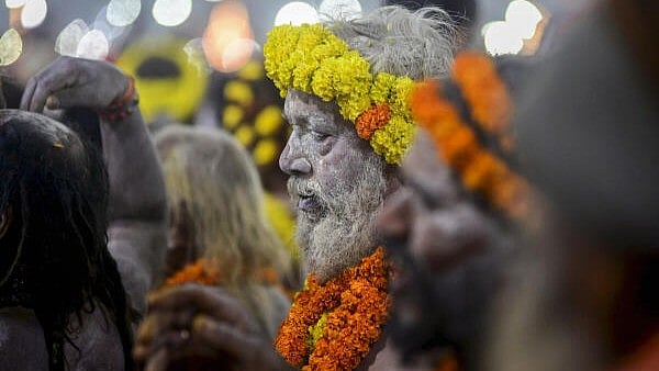 <div class="paragraphs"><p>A 'Naga Sadhu' arrives to take a holy dip at Sangam on the occasion of 'Makar Sankranti' during the Maha Kumbh Mela 2025, in Prayagraj, Uttar Pradesh, Tuesday, Jan. 14, 2025.</p></div>