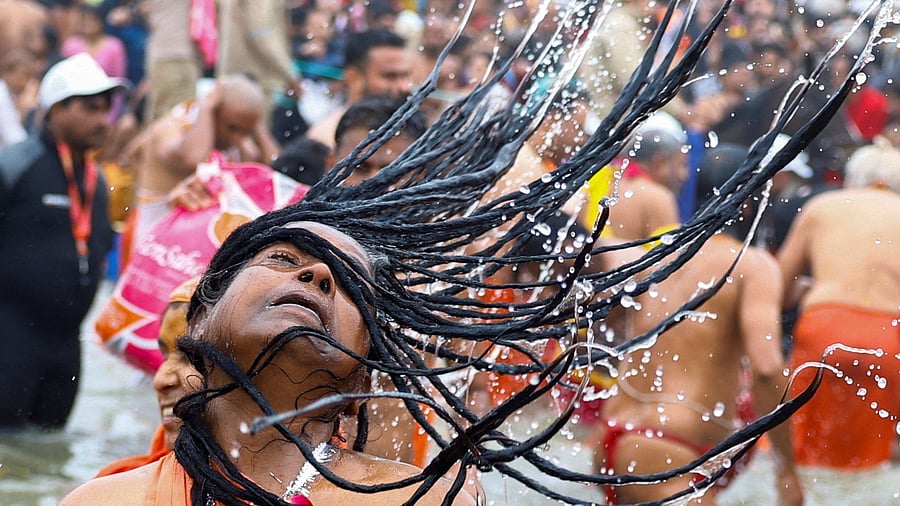 <div class="paragraphs"><p>A Sadhvi or Hindu holy woman takes a holy dip during the "Maha Kumbh Mela", or the Great Pitcher Festival, in Prayagraj, India, January 14, 2025. </p></div>