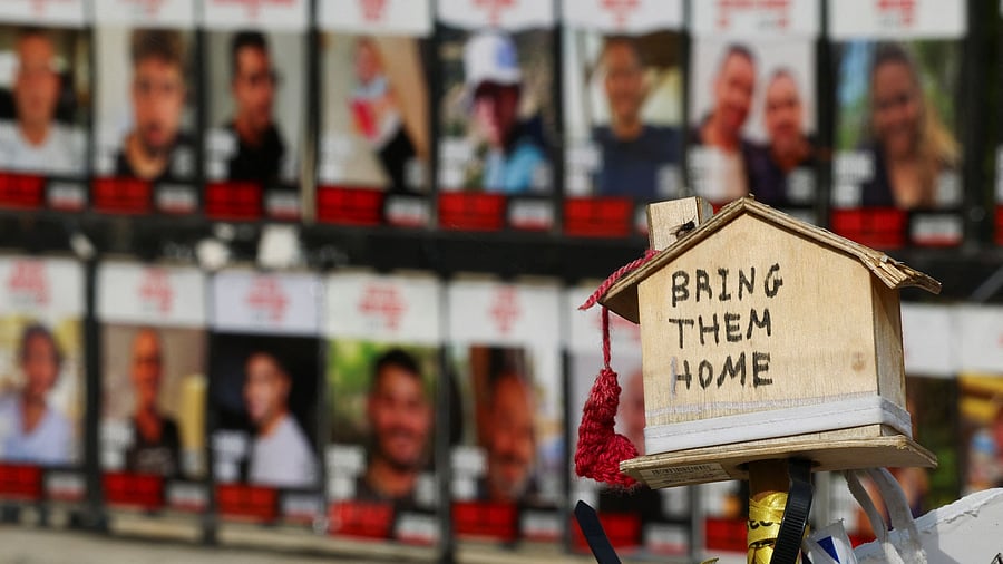 <div class="paragraphs"><p>A message in support of the hostages kidnapped during the deadly October 7, 2023 attack by Hamas and who are still held in captivity is seen near photos of hostages, amid the ongoing conflict in Gaza between Israel and Hamas, at the so-called "Hostages Square" in Tel Aviv, Israel, January 14, 2025. </p></div>