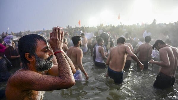 <div class="paragraphs"><p>A devotee takes a holy dip at Sangam on the occasion of 'Makar Sankranti' during the Maha Kumbh Mela 2025, in Prayagraj, Uttar Pradesh, on Tuesday.</p></div>