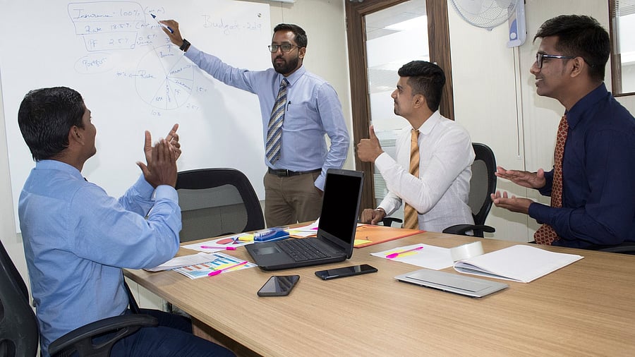 <div class="paragraphs"><p>Business team applauding to their manager for successful presentation about new business strategy</p></div>