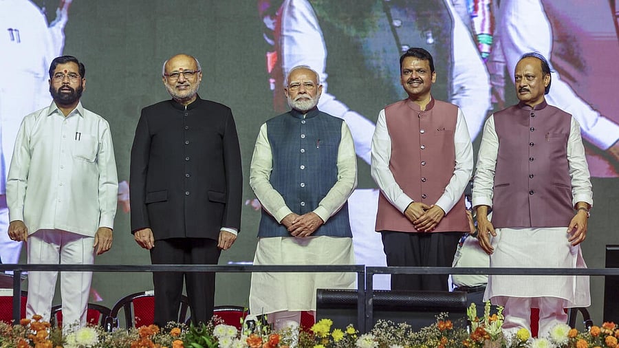 <div class="paragraphs"><p>Prime Minister Narendra Modi and Maharashtra Governor CP Radhakrishnan, second left, with the newly-sworn Maharashtra Chief Minister Devendra Fadnavis, second right, and Deputy Chief Ministers Ajit Pawar, right, and Eknath Shinde, left, during the swearing-in ceremony, in Mumbai</p></div>