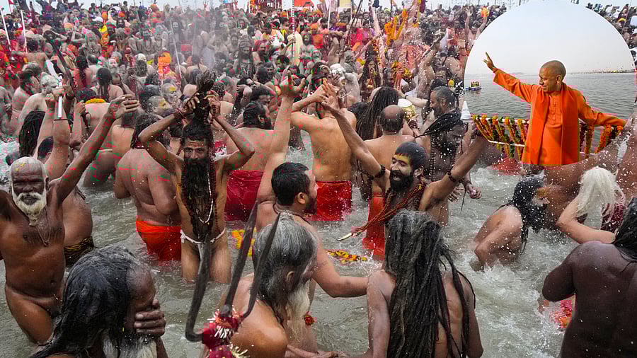 <div class="paragraphs"><p> 'Sadhus' take a holy dip at the Sangam on the occasion of 'Makar Sankranti' festival, during the Maha Kumbh Mela 2025, in Prayagraj, Uttar Pradesh on  January 14, 2025. (Inset: UP CM Yogi Adityanath).</p></div>