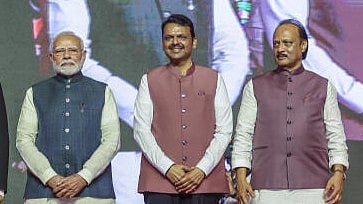<div class="paragraphs"><p>Maharashtra CM Devendra Fadnavis with Deputy CM Ajit Pawar (R) and PM Narendra Modi (L).</p></div>
