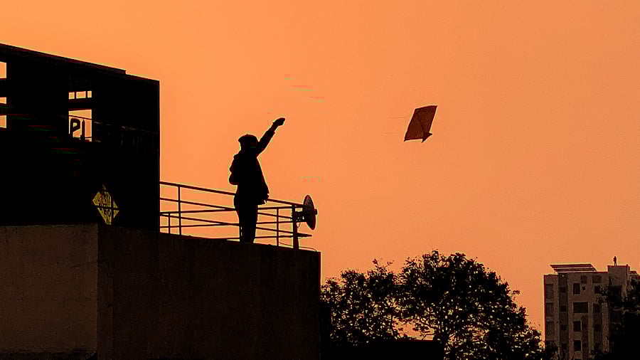 <div class="paragraphs"><p>File photo of a man flying a kite on a roof. (Image for representative purpose)&nbsp;</p></div>