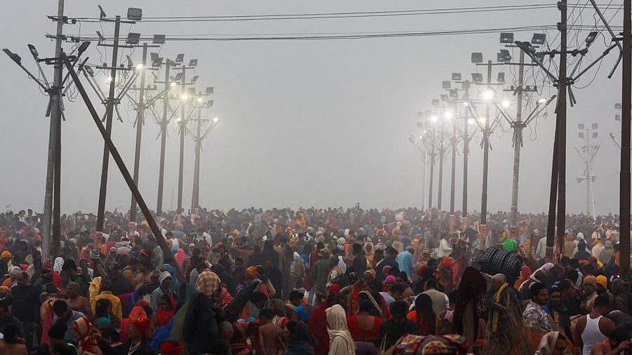 <div class="paragraphs"><p>Devotees gather on the day they take a holy dip at Sangam, the confluence of the Ganges and Yamuna rivers with the mythical, invisible Saraswati river, during the "Maha Kumbh Mela", or the Great Pitcher Festival, in Prayagraj.</p></div>