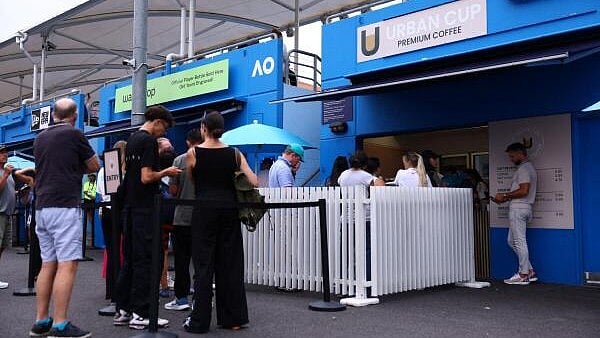 <div class="paragraphs"><p>General view of people buying coffee outside the courts</p></div>