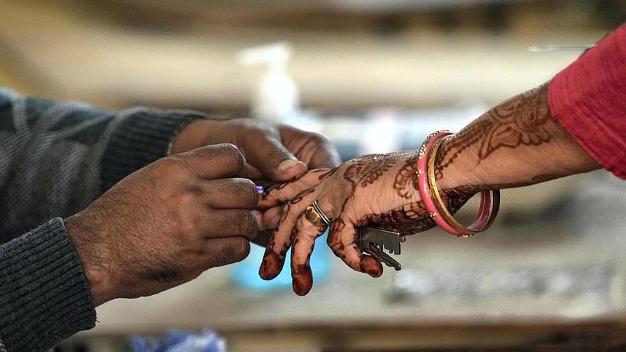 <div class="paragraphs"><p>A voter gets her finger marked with indelible ink. (Representative image)</p></div>