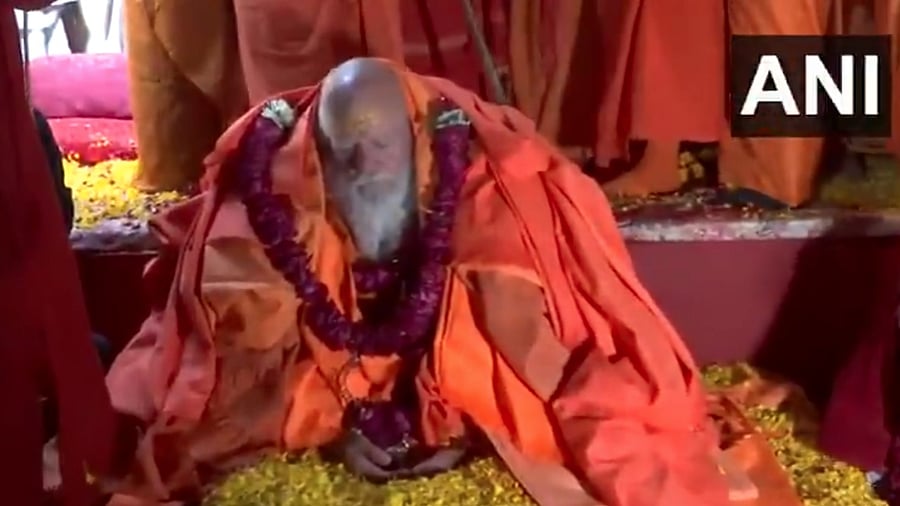 <div class="paragraphs"><p>He calmly moved about in Niranjani Akhara, where he was initiated as 'Mahamandaleshwar' on Sunday, wearing saffron robes and a smile.</p></div>