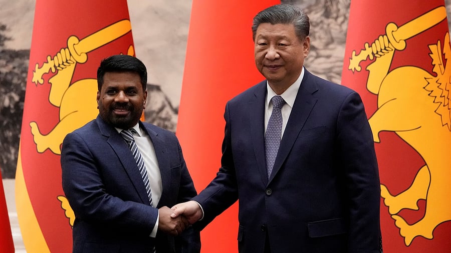 <div class="paragraphs"><p>Chinese President Xi Jinping and Sri Lankan President Anura Kumara Dissanayake shake hands during a signing ceremony at the Great Hall of the People in Beijing, China on Wednesday, Jan 15, 2025.  </p></div>