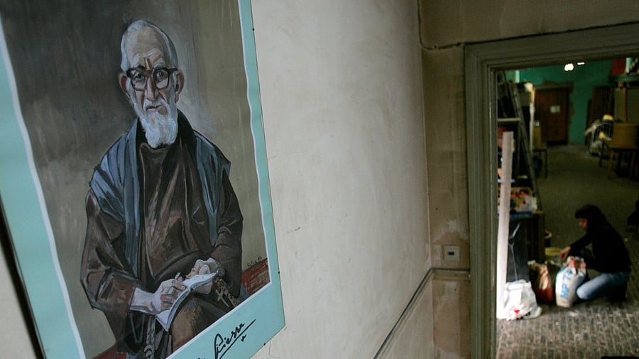 <div class="paragraphs"><p>A portrait of French priest Abbe Pierre hangs on a wall at "La poudriere" centre.</p></div>