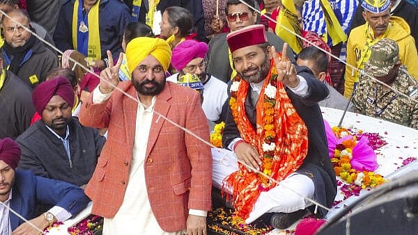 <div class="paragraphs"><p>Punjab Chief Minister and AAP leader Bhagwant Mann with party candidate Vishesh Ravi during a roadshow for the upcoming Delhi Assembly elections, in New Delhi, Friday, Jan. 17, 2025.</p></div>