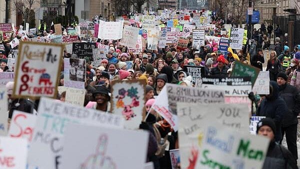 <div class="paragraphs"><p>People attend the "People's March on Washington" ahead of the presidential inauguration of U.S. President-elect Donald Trump, in Washington, U.S., January 18, 2025.</p></div>