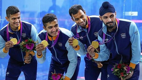 <div class="paragraphs"><p>Gold medallists India's Saurav Ghosal, Abhay Singh, Mahesh Mangaonkar and Harinder Pal Sandhu pose for photos during the presentation ceremony of the Squash Men's Team event at the 19th Asian Games, in Hangzhou.</p></div>
