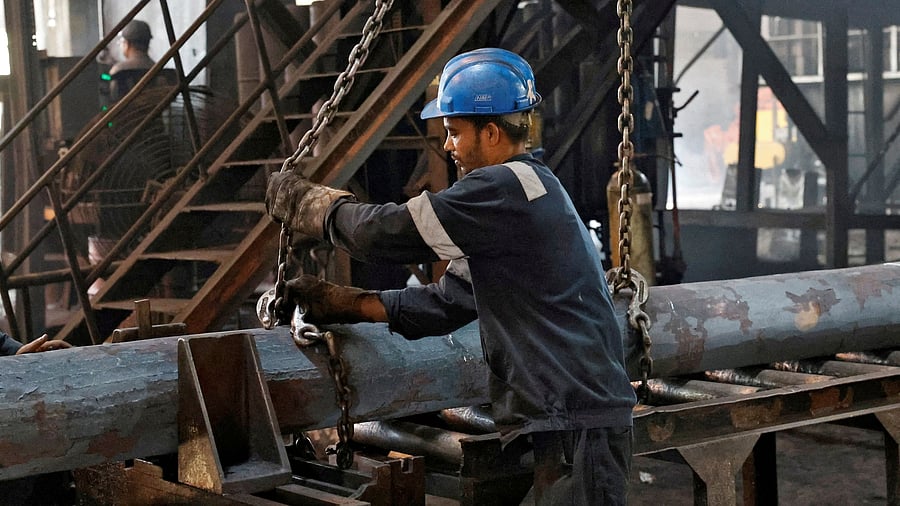<div class="paragraphs"><p>An employee prepares to move a heavy bar of steel inside the ArcVac ForgeCast factory, in Hooghly district, in the eastern state of West Bengal, India.&nbsp;</p></div>