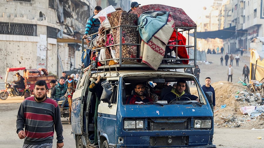 <div class="paragraphs"><p>Displaced Palestinians with their belongings in a vehicle makes their way past rubble as they attempt to return to their homes following a delay in the ceasefire between Israel and Hamas over the hostage list, in the northern Gaza Strip January 19, 2025. </p></div>