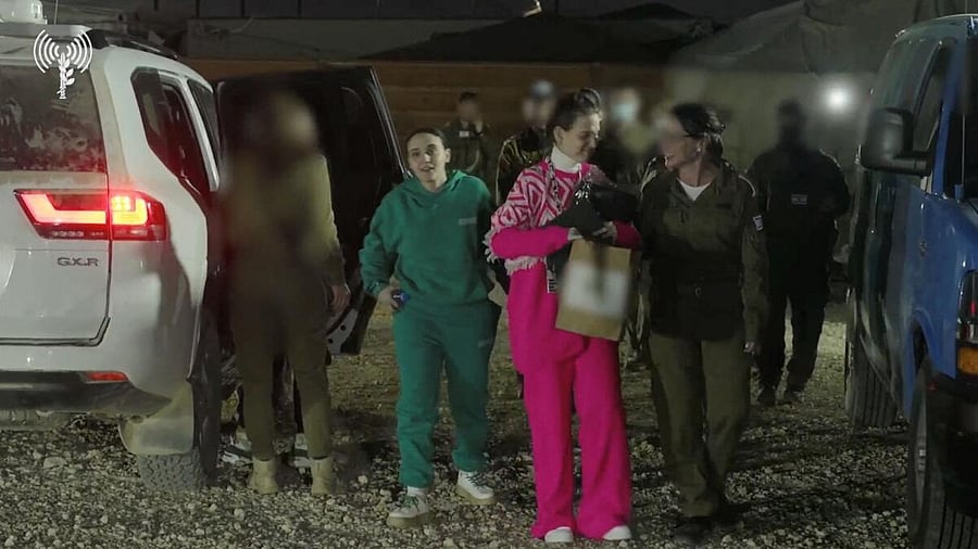 <div class="paragraphs"><p>Released hostages Doron Steinbrecher and Emily Damari are greeted by Israeli soldiers following their arrival in Israel after being held in Gaza since the deadly October 7 2023 attack, following their release as part of a hostage-prisoner exchange deal between Hamas and Israel, in southern Israel</p></div>