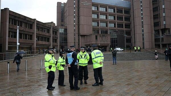 <div class="paragraphs"><p>Police officers stand outside the front of Liverpool Crown Court at the start of the trial of Axel Rudakubana, in Liverpool, Britain.</p></div>