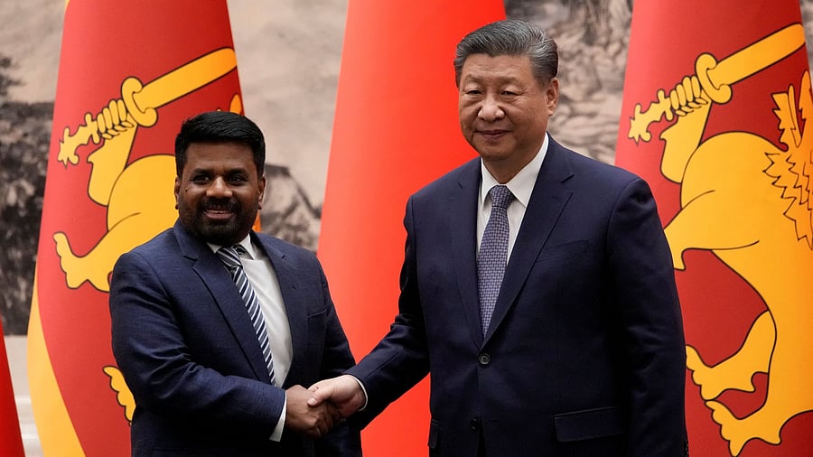 <div class="paragraphs"><p>Chinese President Xi Jinping and Sri Lankan President Anura Kumara Dissanayake shake hands during a signing ceremony at the Great Hall of the People in Beijing, China on Wednesday, Jan 15, 2025.</p></div>