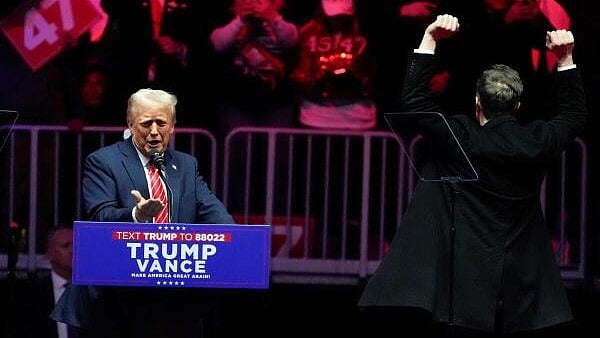 <div class="paragraphs"><p>US President-elect Donald Trump speaks as Tesla CEO and X owner Elon Musk gestures during a rally the day before Trump is scheduled to be inaugurated for a second term, in Washington, US, January 19, 2025.</p></div>