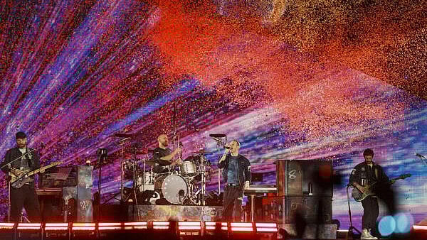 <div class="paragraphs"><p>British band Coldplay’s members Chris Martin, second right, Jonny Buckland, left, Will Champion, second left, and Guy Berryman perform during the band’s ‘Music Of The Spheres World Tour’ Produced and Promoted By BookMyShow Live, at the D Y Patil Sports Stadium, in Navi Mumbai.</p></div>