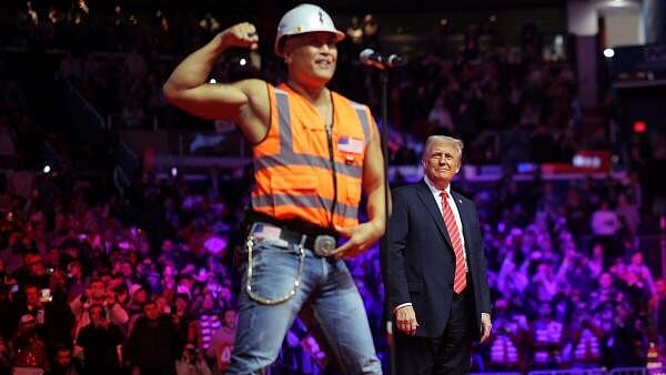 <div class="paragraphs"><p>US President-elect Donald Trump stands onstage as the Village People perform during a rally the day before he is scheduled to be inaugurated for a second term, in Washington. </p></div>