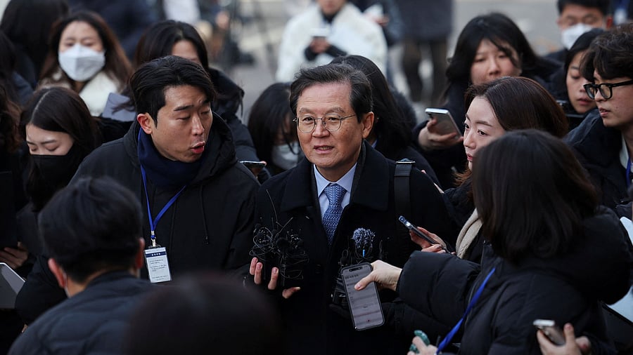 <div class="paragraphs"><p>Impeached South Korean President Yoon Suk Yeol's lawyer Yoon Kab-keun makes his way through media members upon his arrival at the Constitutional Court in Seoul, South Korea, January 21, 2025.   </p></div>