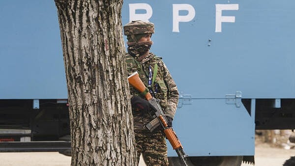 <div class="paragraphs"><p>A security personnel stands guard near the site of the encounter, at Gujjarpati area in Sopore, Baramulla district of Jammu and Kashmir.</p></div>