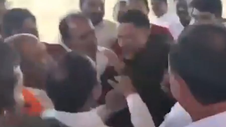 <div class="paragraphs"><p>Screengrab from a video showing BJP MP Etela Rajender slapping a realtor in&nbsp;Telangana's Malkajgiri.</p></div>