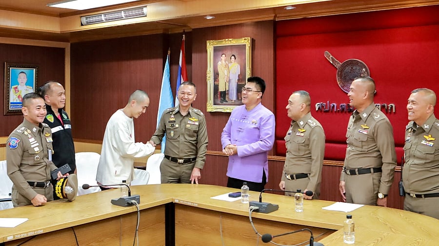 <div class="paragraphs"><p>Chinese actor Wang Xing shakes hands with a Thai police officer after being assisted in his return to the country, after being kidnapped into one of the telecom fraud centers, at a police station in Thailand-Myanmar border's Mae Sot district, Tak province, Thailand</p></div>