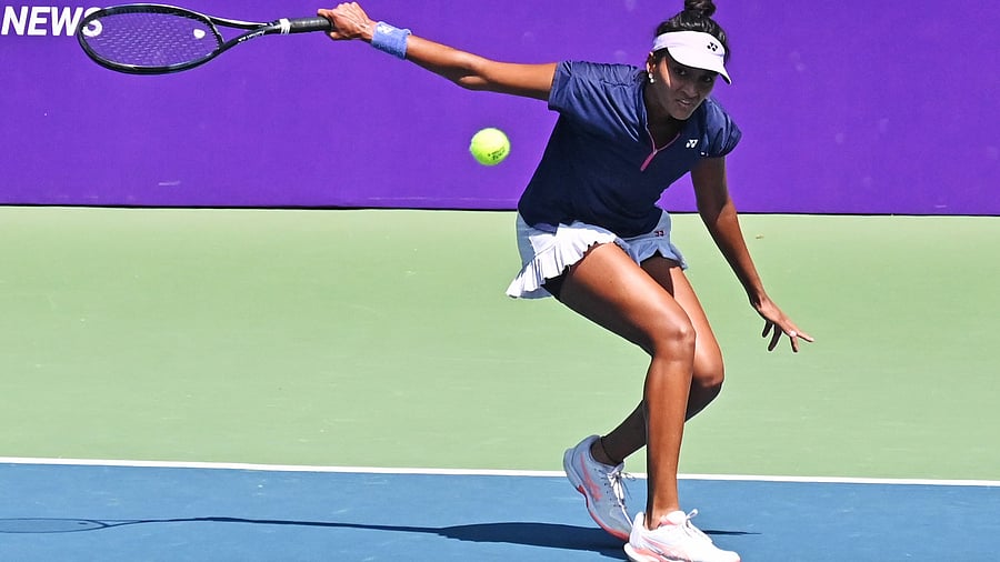 <div class="paragraphs"><p>India's Sahaja Yamalapalli plays a backhand during her first round win over Great Britain's Yuriko Lily Miyazaki in the KPB Trust Women’s Open at the KSLTA courts in Bengaluru on Wednesday. </p></div>