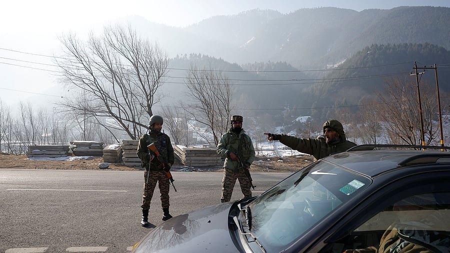 <div class="paragraphs"><p>Indian security personnel stop the vehicles for the security check </p></div>