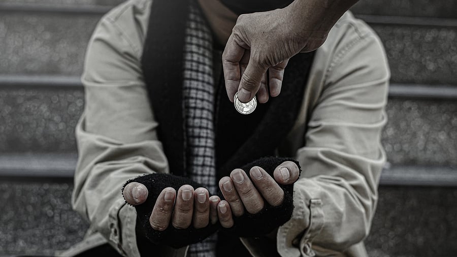 <div class="paragraphs"><p>A person giving alms to a beggar. Representative image.</p></div>