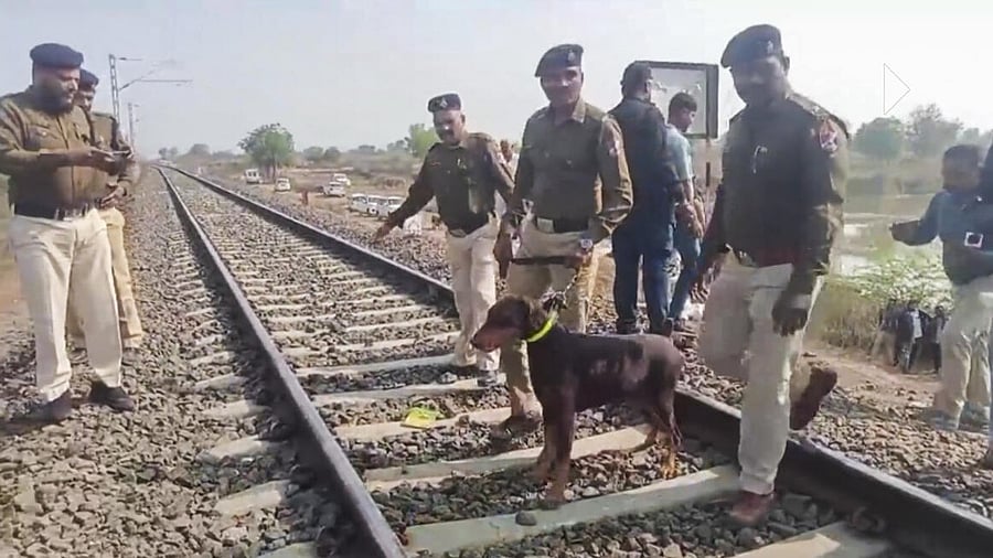 <div class="paragraphs"><p>Police personnel during inspection of tracks a day after a train mishap, in Jalgaon district</p></div>