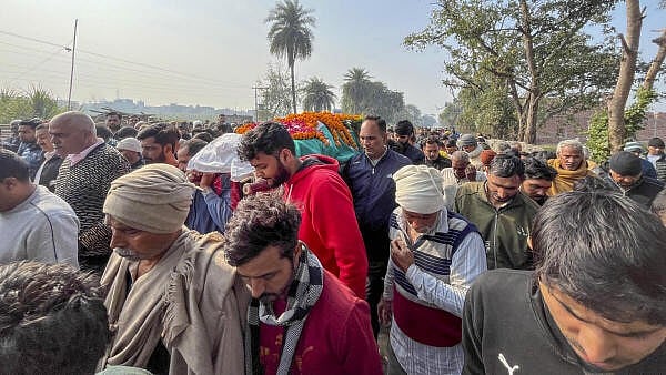 <div class="paragraphs"><p>People take part in the funeral procession of STF Inspector Sunil Kumar who was killed during an encounter between police and criminals, in Shamli, Uttar Pradesh, Thursday. </p></div>