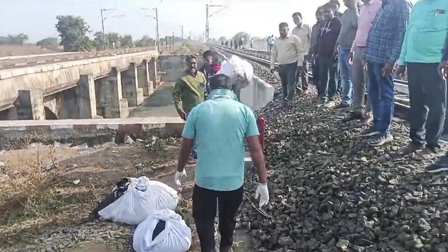 <div class="paragraphs"><p>Rescue teams remove belongings a day after a train mishap, in Jalgaon district.</p></div>
