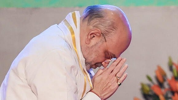 <div class="paragraphs"><p>Amit Shah offering prayers.</p></div>
