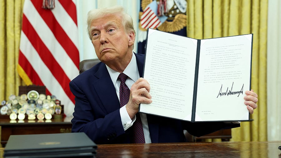 <div class="paragraphs"><p>US President Donald Trump holds a signed executive order on AI, in the Oval Office of the White House, in Washington, U.S., January 23, 2025. </p></div>
