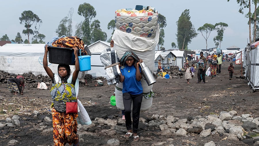 <div class="paragraphs"><p>FILE PHOTO: Civilians carry their belongings as they flee from the Nzulo camp for the internally displaced to Goma, as fighting intensifies between the M23 rebels and the Armed Forces of the Democratic Republic of the Congo , near Goma, Democratic Republic of Congo January 22, 2025. </p></div>