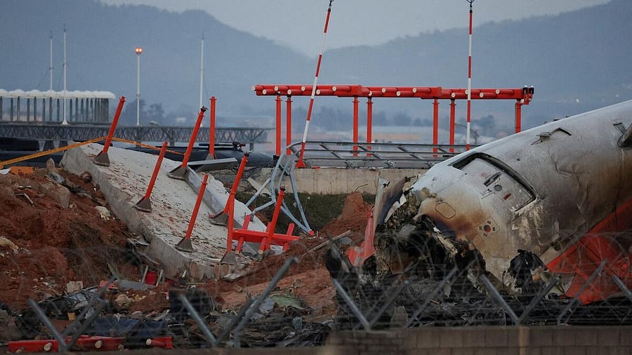 <div class="paragraphs"><p>The wreckage of the Jeju Air aircraft that went off the runway and crashed at Muan International Airport lies near a concrete structure it crashed into, in Muan, South Korea, December 30, 2024. </p></div>