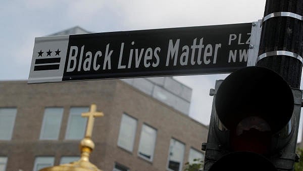 <div class="paragraphs"><p>A sign reading "Black Lives Matter' is seen on a light pole.</p></div>