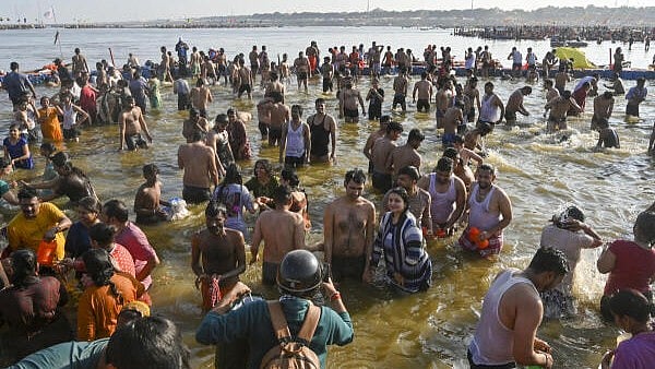 <div class="paragraphs"><p>Devotees take a holy dip at Sangam during the ongoing Maha Kumbh Mela 2025, in Prayagraj, Saturday, Jan. 25, 2025.</p></div>