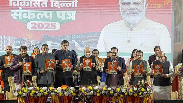 <div class="paragraphs"><p>Union Home Minister Amit Shah along with Delhi BJP President Virendra Sachdeva, Union MoS Harsh Malhotra, BJP MPs Manoj Tiwari and Ramvir Singh Bidhuri, and others releases third part of BJP's manifesto for the upcoming Delhi Assembly elections, in New Delhi, Saturday.&nbsp;</p></div>